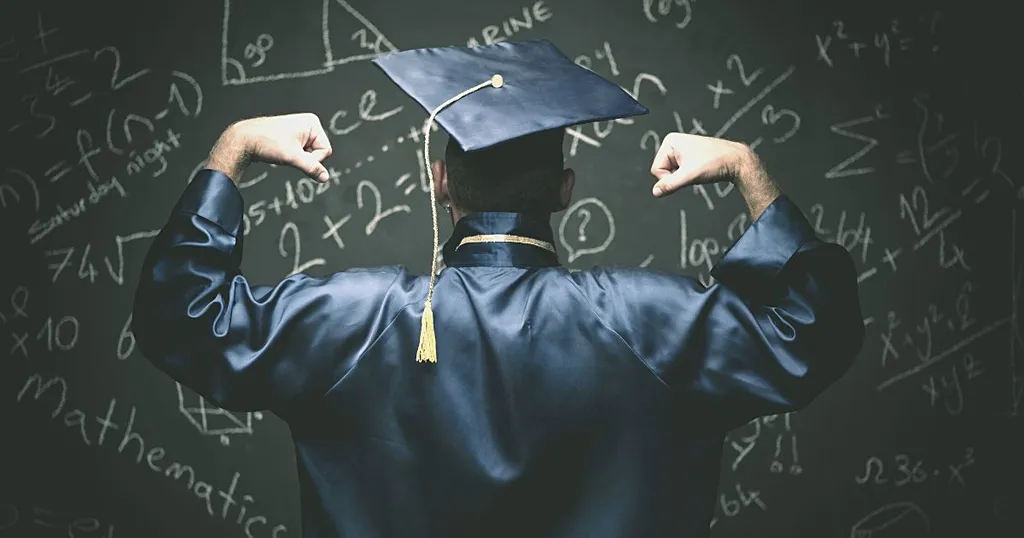 Graduate in cap and gown, seen from behind, in front of a blackboard covered with calculations